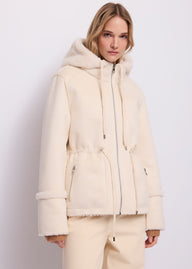 Giacca da donna in shearling con cappuccio