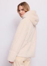 Giacca da donna in shearling con cappuccio
